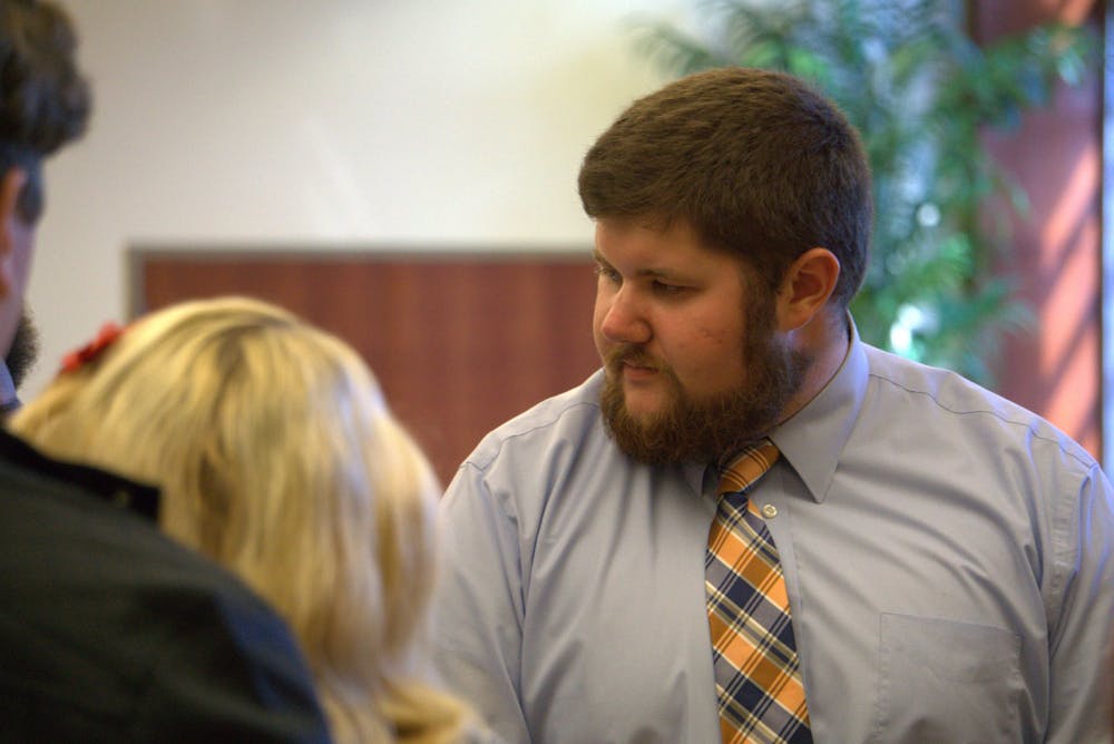 <p>SGA Senator Jake Biller speaks with other senators during an August 2019 meeting. Biller proposed an amendment to make commenting during floor debates easier for gallery observers. <strong>John Lynch, DN</strong></p>