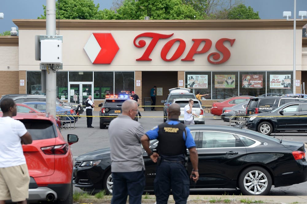 CREDIT: Tribune News Service- Police on scene at a Tops Friendly Market on Saturday, May 14, 2022, in Buffalo, New York. According to reports, at least 10 people were killed after a mass shooting at the store, with the shooter in police custody. (John Normile/Getty Images/TNS)