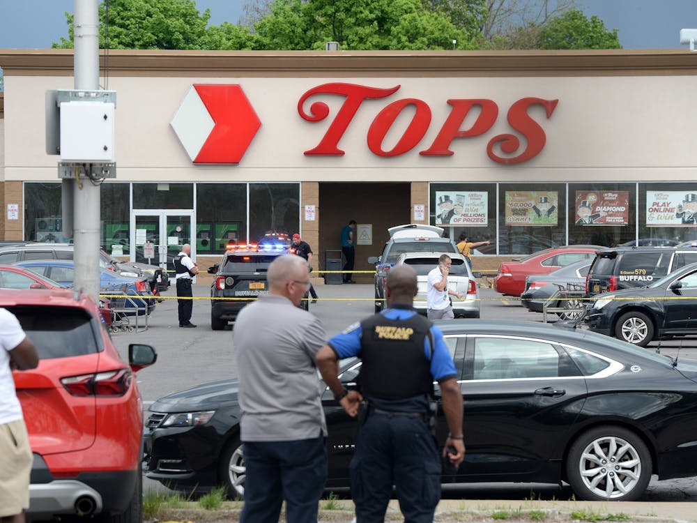 CREDIT: Tribune News Service- Police on scene at a Tops Friendly Market on Saturday, May 14, 2022, in Buffalo, New York. According to reports, at least 10 people were killed after a mass shooting at the store, with the shooter in police custody. (John Normile/Getty Images/TNS)