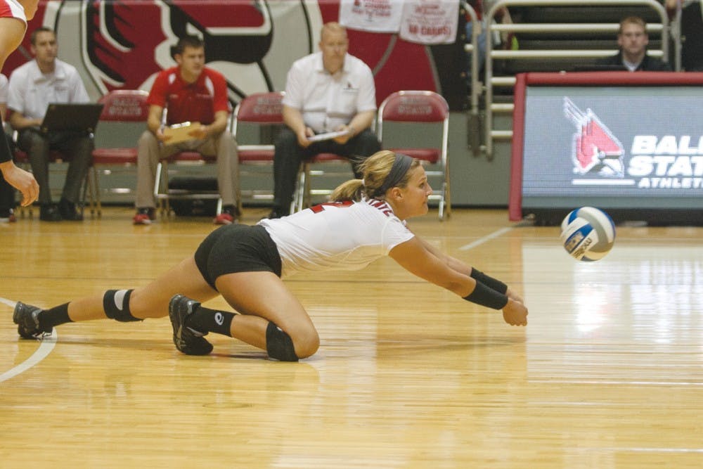 Sophomore outside hitter Alex Fuelling dives for a ball during a game this season. Fuelling wears the No. 2 jersey, just like her mother did, for Ball State. DN FILE PHOTO JORDAN HUFFER