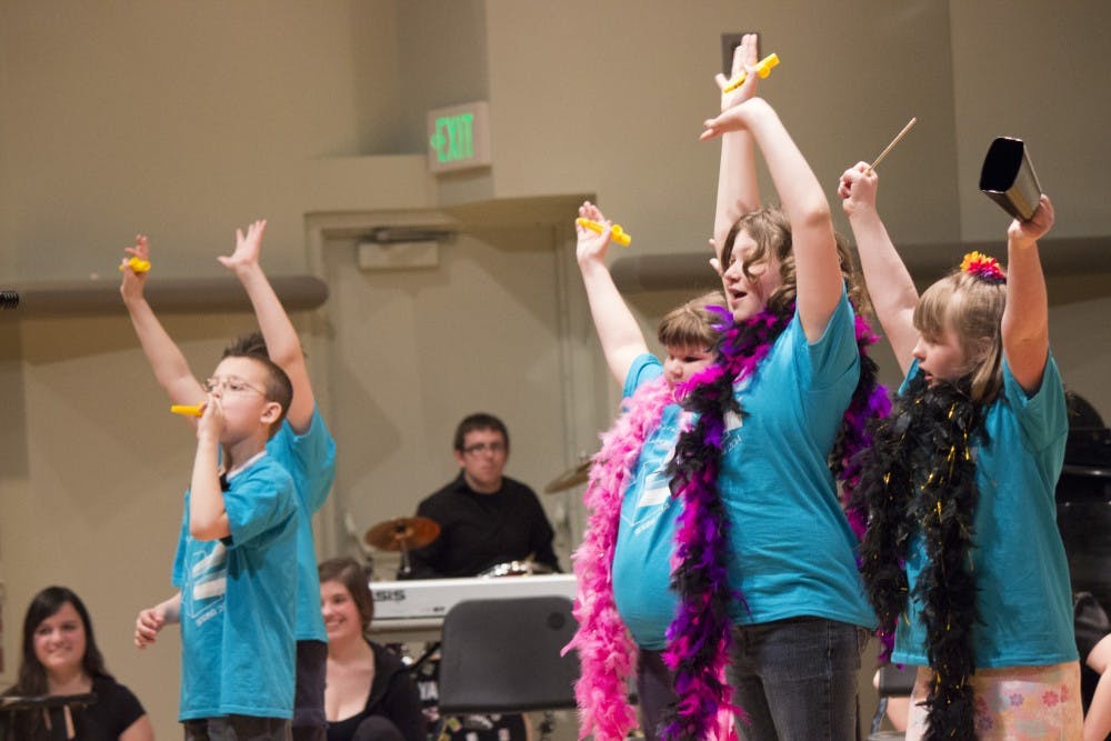 Members of the Yellow group sing along to an Elvis song during the Prism Project  on April 2 at Pruis Hall. DN PHOTO ALISON CARROLL