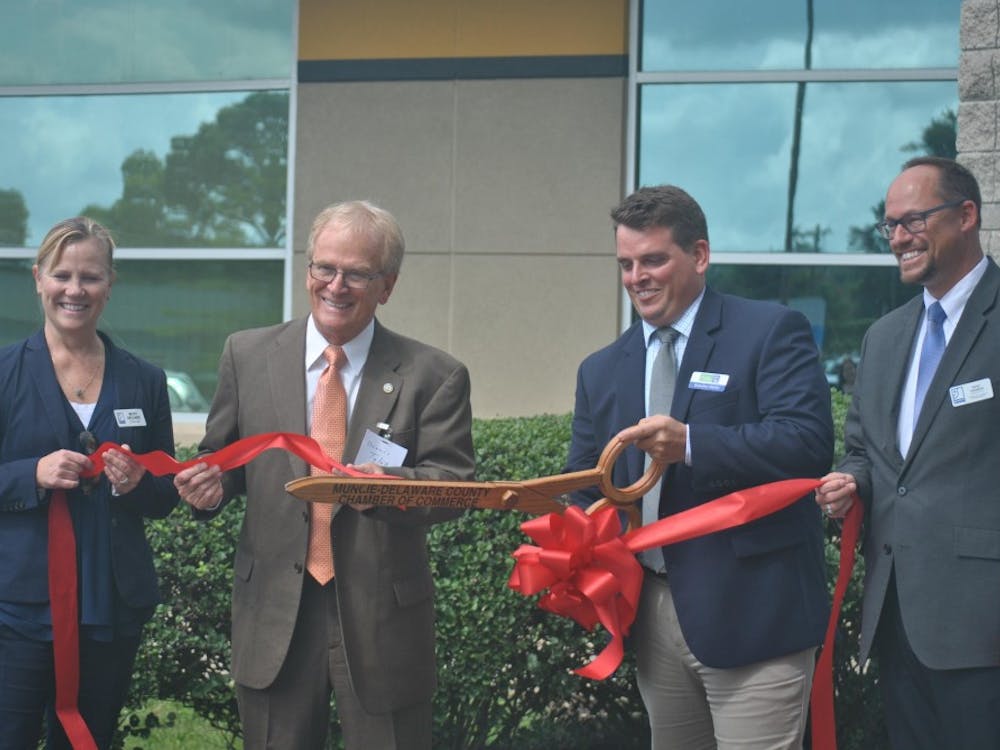 The Excel Center, an adult high school, was officially opened Wednesday when Betsy Delgado, Muncie Mayor Dennis Tyler, Brandon Marks and Kent Kramer cut the ribbon. The high school is free for students because of donations from Goodwill. Pauleina Brunnemer, DN&nbsp;
