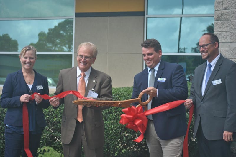 The Excel Center, an adult high school, was officially opened Wednesday when Betsy Delgado, Muncie Mayor Dennis Tyler, Brandon Marks and Kent Kramer cut the ribbon. The high school is free for students because of donations from Goodwill. Pauleina Brunnemer, DN&nbsp;