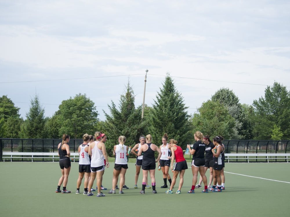 The field hockey team meets in a circle after running during practice on Aug. 26 at the Briner Sports Complex. The team plays at 2 p.m on Aug. 31 against Davidson at Boone, N.C. DN PHOTO BREANNA DAUGHERTY 