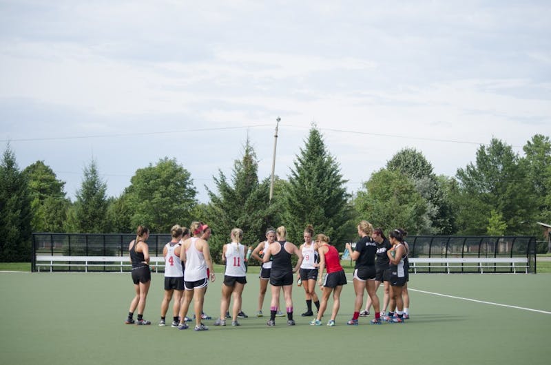 The field hockey team meets in a circle after running during practice on Aug. 26 at the Briner Sports Complex. The team plays at 2 p.m on Aug. 31 against Davidson at Boone, N.C. DN PHOTO BREANNA DAUGHERTY 
