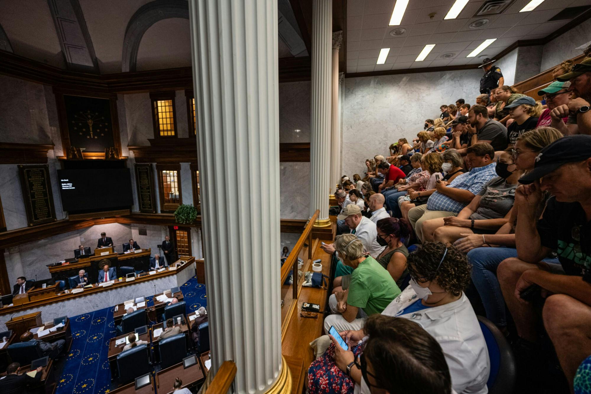 INDIANAPOLIS, IN - JULY 25: Indiana State Senators meet in the Senate chamber while members of the public watch from the gallery in the Indiana State Capitol building on July 25, 2022, in Indianapolis, Indiana. Activists are gathering during a special session of the Indiana state Senate concerning abortion access in the state. (Photo by Jon Cherry/Getty Images)