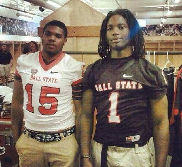 Seen in this leaked photo two men stand showing off the new black uniforms that will be debuted on the last home football game Nov. 14. The new uniforms are to support the university “blackout” theme. PHOTO PROVIDED BY GABE KUHN