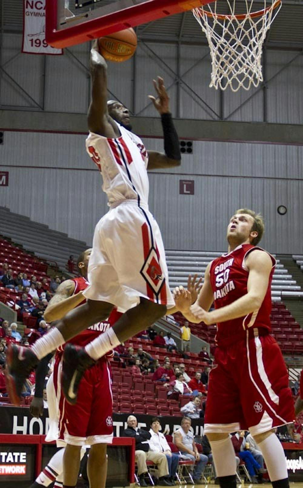 Junior forward Chris Bond jumps up for a dunk in Worthen Arena Saturday afternoon against South Dakota. The Cardinals won 62-51. DN PHOTO EMMA FLYNN