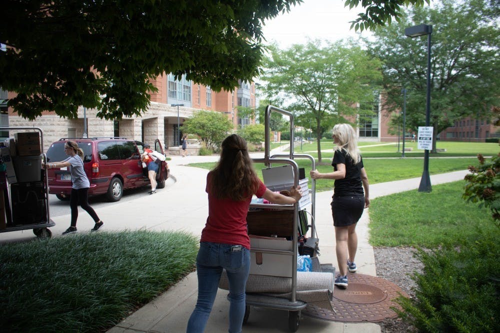 Erin Simons moves in during Welcome Week Aug. 18, 2018, at Woodworth Complex. This year students were asked to &nbsp;select a move in time to reduce the number of people moving in at a given time. Rebecca Slezak, DN File