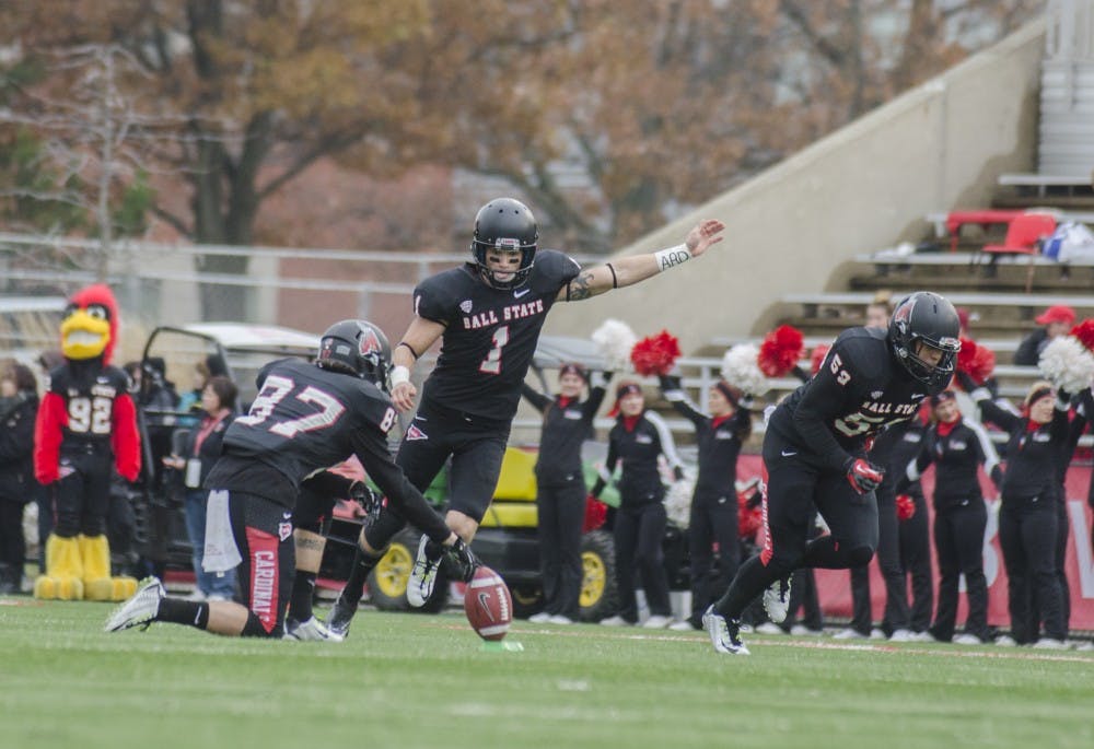 Senior kicker Scott Secor kicks the ball off after scoring a touchdown during the game against Eastern Michigan on Nov. 22 at Scheumann Stadium. DN PHOTO BREANNA DAUGHERTY