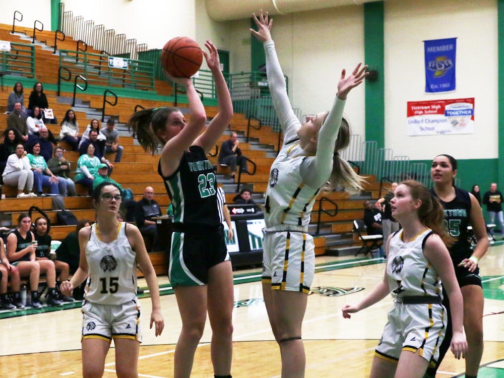Yorktown sophomore Lilly Syllvester shoots the ball Jan. 9 during the first round of the Delaware County Tournament against Cowan at Yorktown High School. David Moore, DN
