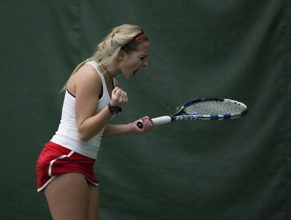  Sophomore Peyton Gollhofer reacts after winning a point during her singles match against Wright State on Feb. 5. Emma Rogers // DN