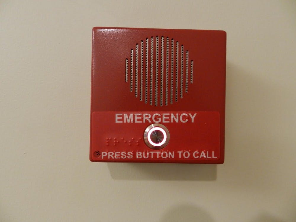 The university is working on setting up red emergency call boxes in classrooms. The boxes create a direct link to the University Police Department. DN PHOTO ERIN GLADIEUX