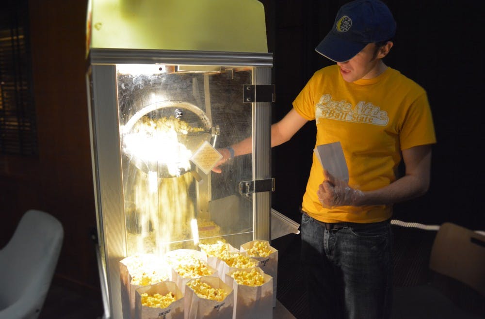 Eric Dewell, music media production and industry major, pops popcorn during the 