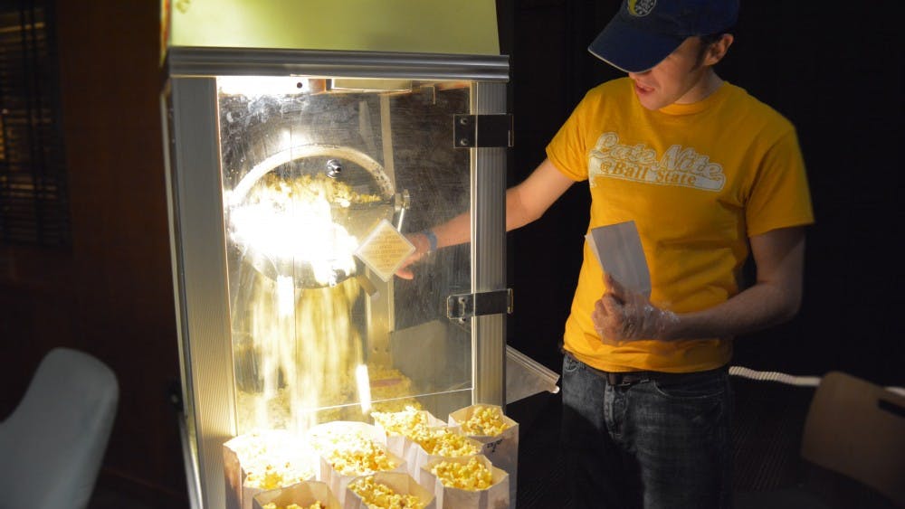 Eric Dewell, music media production and industry major, pops popcorn during the 