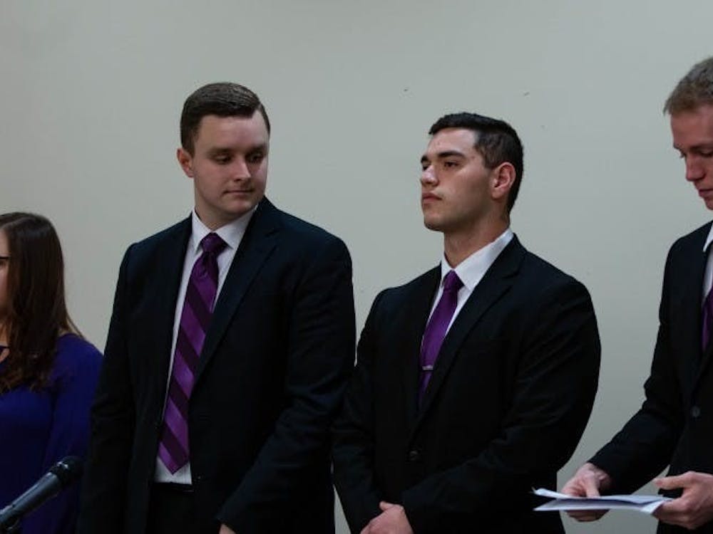 (Left to Right) Elevate slate members Cassidy Mattingly, secretary, Cameron DeBlasio, vice president, Aiden Medellin, president, and David Sinclair, treasurer, stand before the All-Slate Debate Feb. 18, 2019, in the L.A. Pittenger Student Center ball room. Elevate was the Student Government Association slate for the 2019-20 academic year. Scott Fleener, DN File