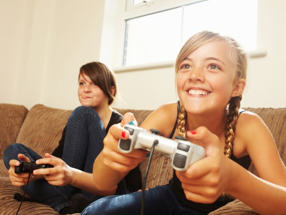 Two girls playing video game