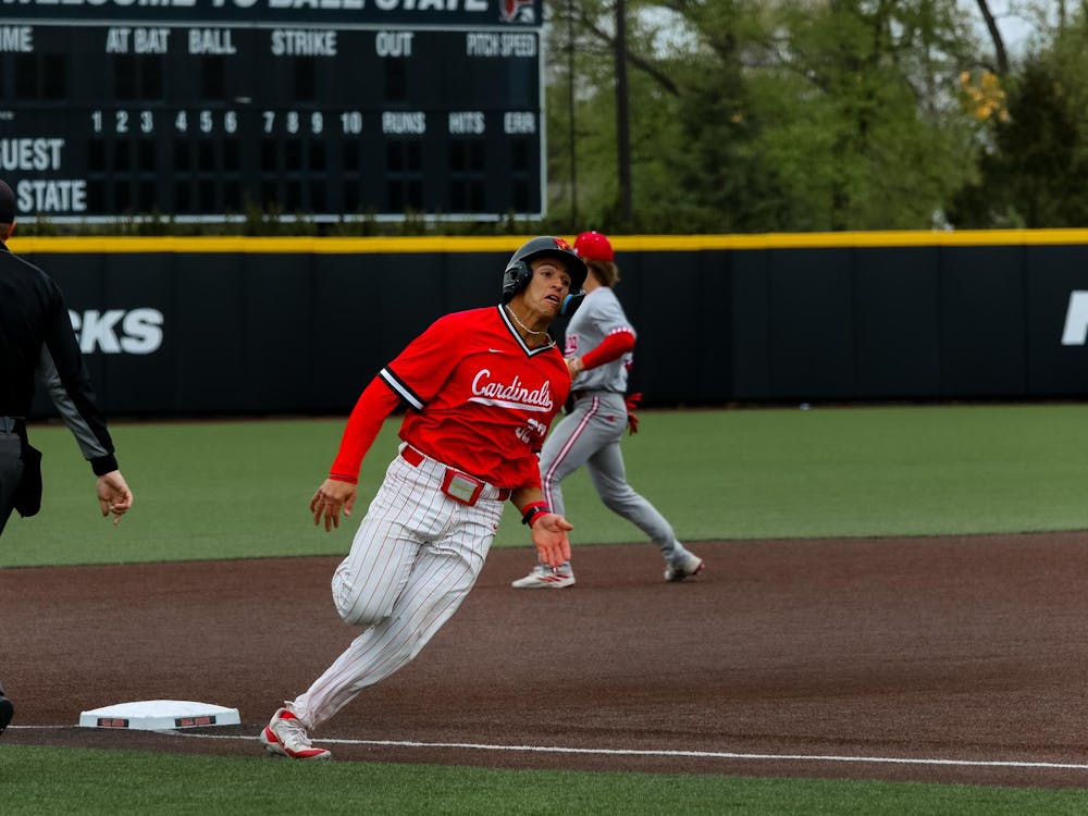 Junior catcher Hunter Dobbins rounds the baseline home against Indiana University April 24 at First Merchants Ballpark. Dobbins hit and caught during the game against IU. Isabella Kemper, DN
