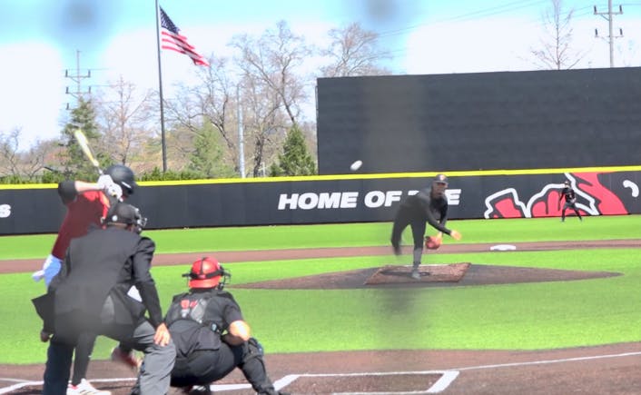 Ball State Pitcher Jacob Hartlaub striking out an NIU player.