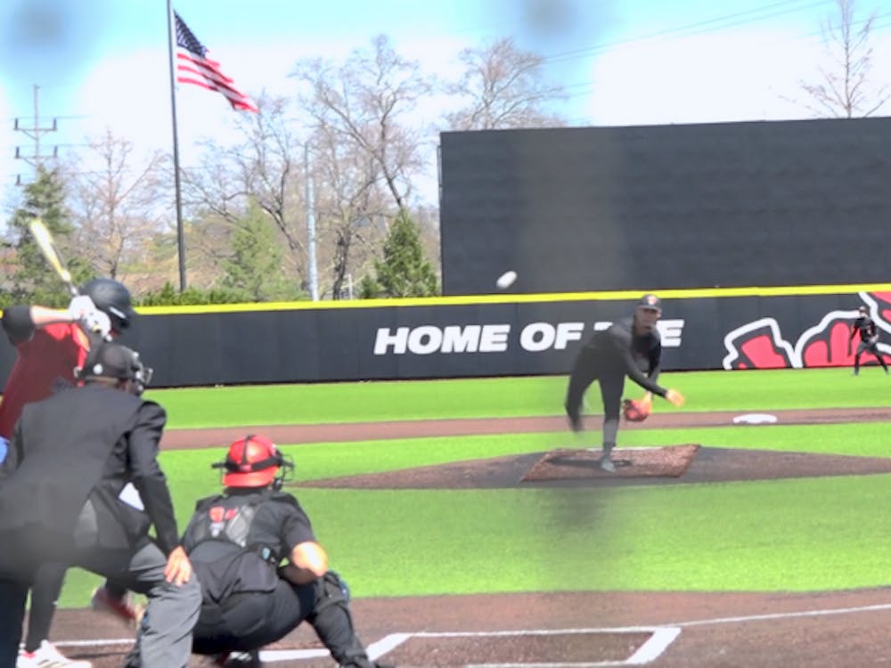 Ball State Pitcher Jacob Hartlaub striking out an NIU player.