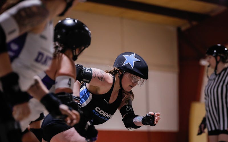 A member of Muncie’s Cornfed Roller Derby team skates against Dayton Roller Derby Feb. 15 at the Delaware County Fairgrounds. Andrew Berger, DN 