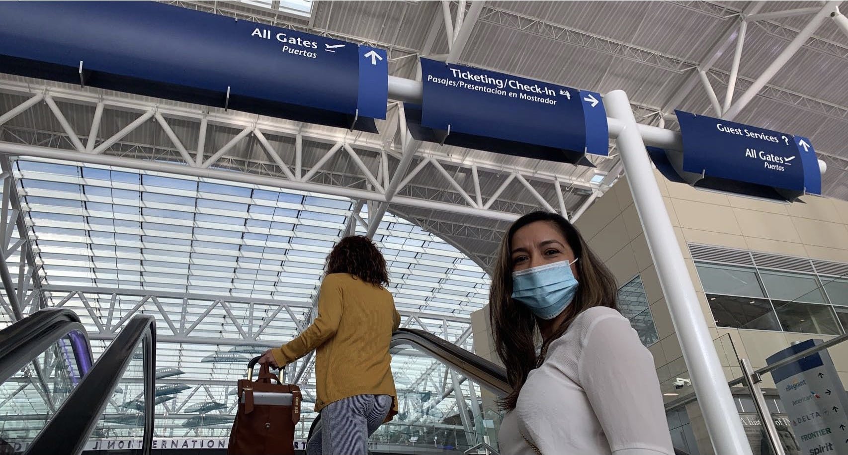 Maggie Hartill goes up the escalator as she waits for her flight. (Evan Chandler/ Ball Bearings Magazine) 