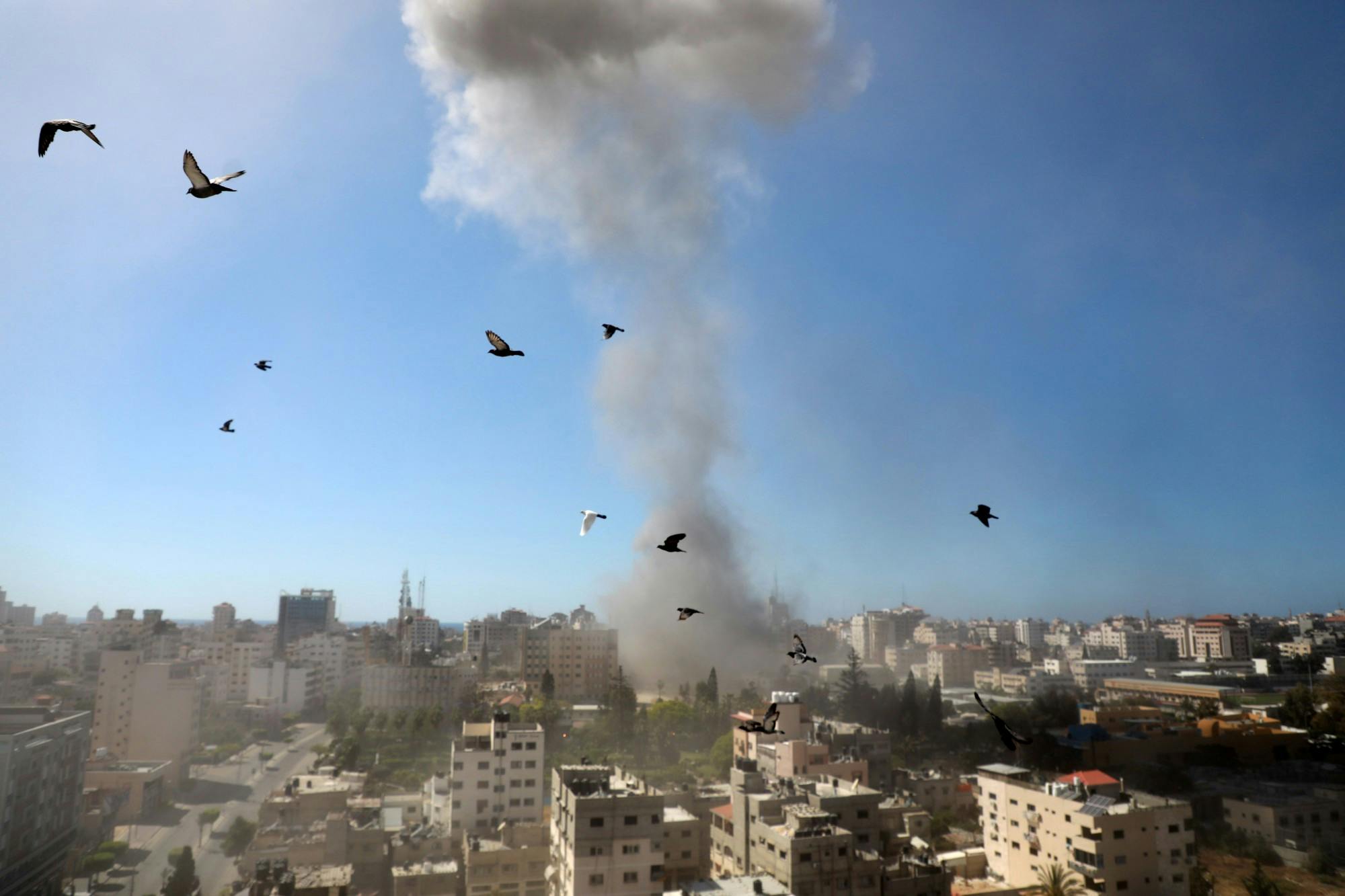 A thick column of smoke rises from the Jala Tower as it is destroyed in an Israeli airstrike in Gaza City controlled by the Palestinian Hamas movement, on May 15, 2021. The ongoing Israeli attacks on the Gaza Strip have left dozens of people dead and more than 1,000 others injured. (Majdi Fathi/NurPhoto/Zuma Press/TNS)