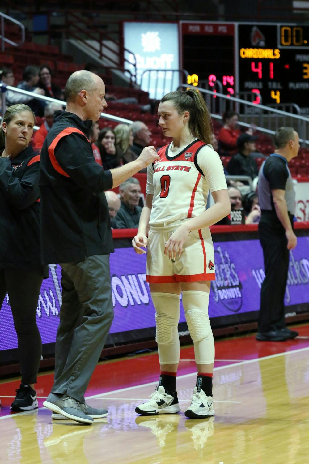 Sophomore Ally Becki (right) talks to Head Coach Brady Sallee (left) in a game against St. Louis Dec. 5 at Worthen Arena. Becki finished with four steals in the game. Brayden Goins, DN