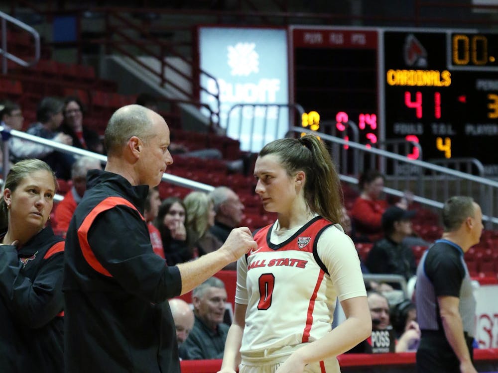Sophomore Ally Becki (right) talks to Head Coach Brady Sallee (left) in a game against St. Louis Dec. 5 at Worthen Arena. Becki finished with four steals in the game. Brayden Goins, DN