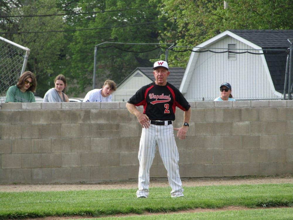 <p>Former Wapahani High School Baseball head coach Brian Dudley coaches the Raiders from third base during their game against Cowan High School at Tiger Field in Yorktown, Indiana, May 17, 2022. The Raiders defeated the Blackhawks to advance in the 2022 Delaware County Baseball Tournament. (Kyle Smedley/DN)</p>