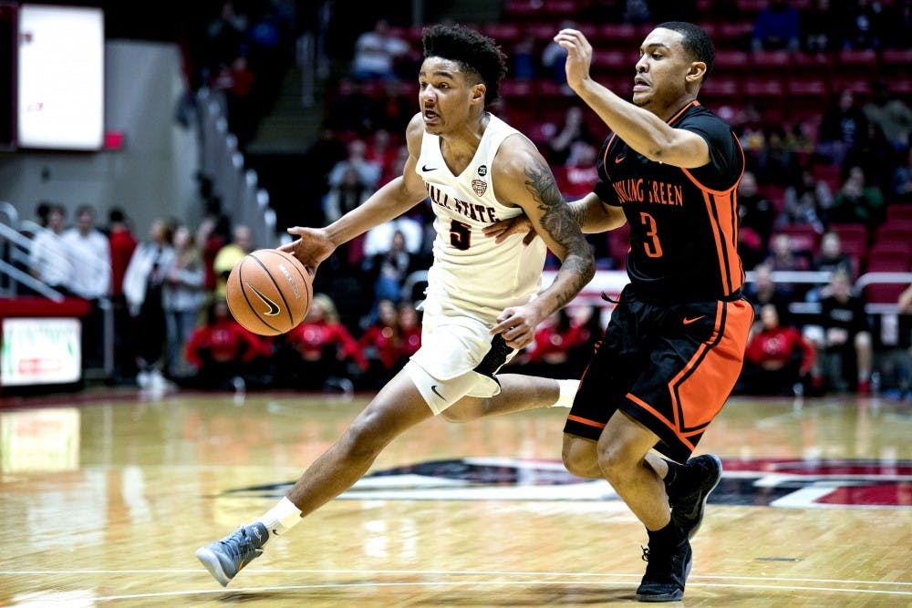 <p>Freshman guard Ishmael El-Amin, pushes past Bowling Green’s Rodrick Caldwell in the first half, Feb. 6 at John E. Worthen Arena. The team reached the Sweet 16 in 1990 before falling to eventual National Champion UNLV. <strong>Grace Hollars, DN</strong></p>