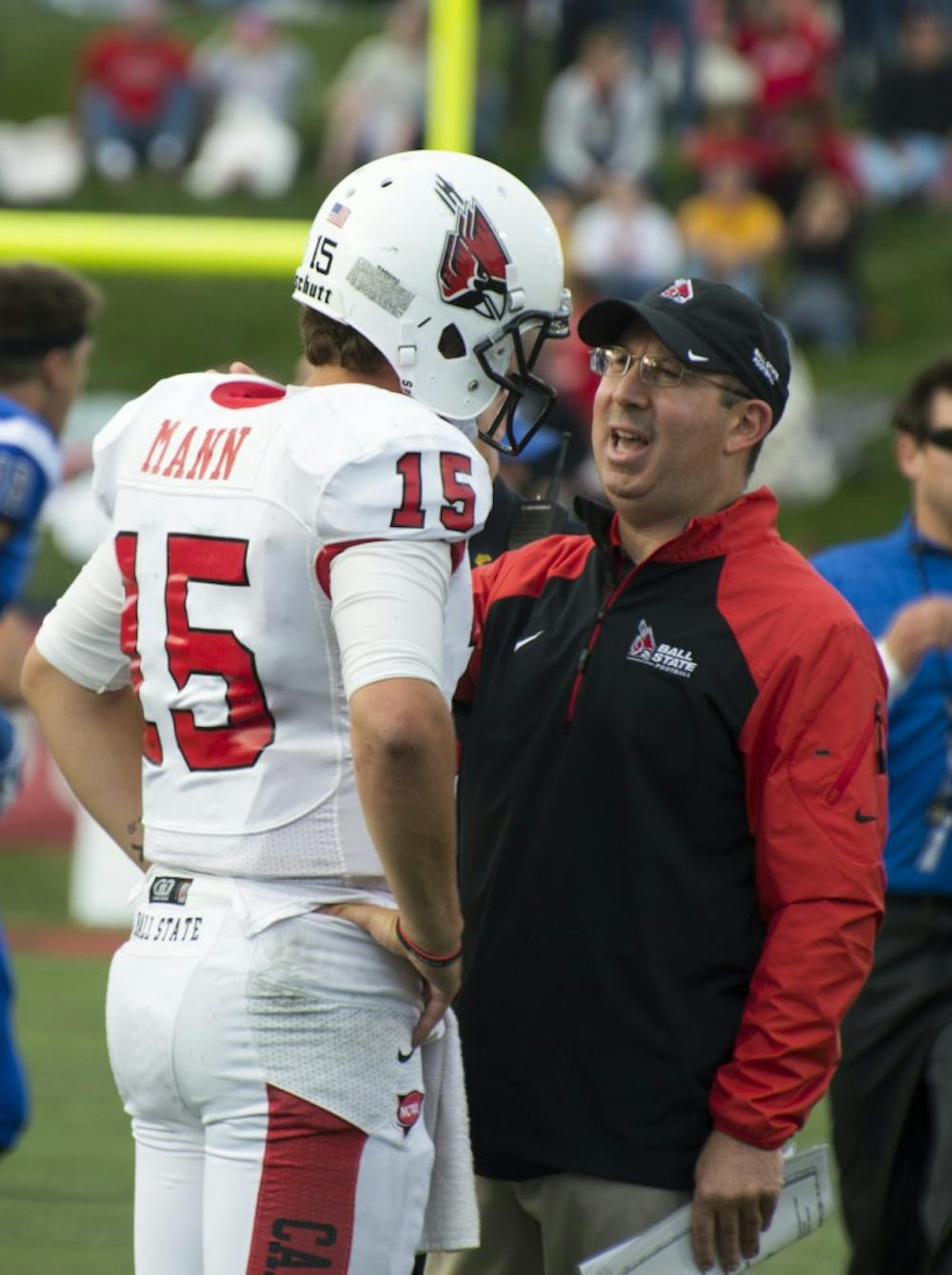 Head coach Pete Lembo talks to redshirt sophomore Ozzie Mann after the football game against Indiana State on Sept. 13 at Scheumann Stadium. DN PHOTO ALAINA JAYE HALSEY