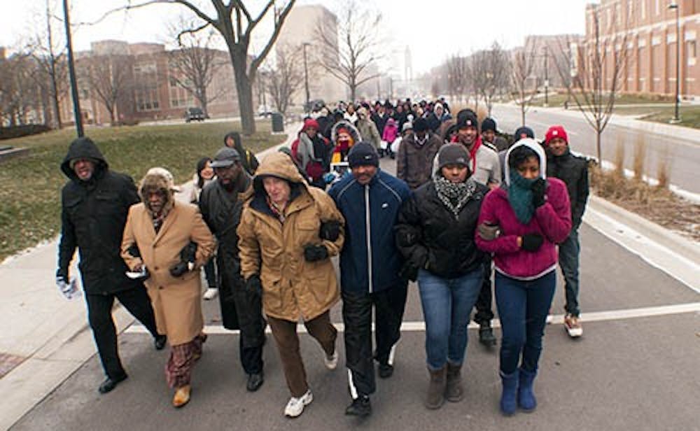 Participants of the Unity March walk down McKinley Ave. on Monday in honor of Martlin Luther King, Jr. Day. Events to commemorate Dr. King's vision will continue throughout the week as part of Unity Week. DN PHOTO BOBBY ELLIS