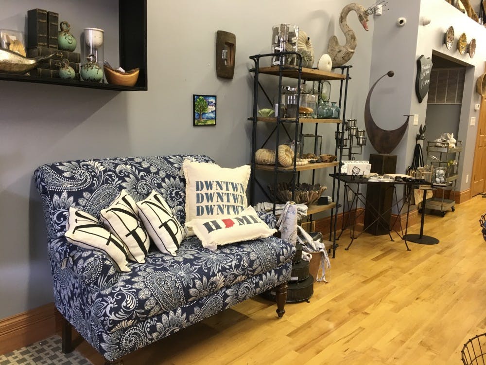 Olive and Slate is full of knick-knacks and accessories that range from gifts to home decor, The downtown Muncie store is owned by Sean Hale and his wife Heidi. Michelle Kaufman // DN