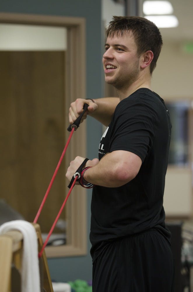 Keith Wenning works with a resistance band to stretch his arms on Feb. 1 at the St. Vincent Sports Performance Center in Indianapolis, IN. Wenning is training for the NFL Combine on Feb. 22-25. DN FILE PHOTO BREANNA DAUGHERTY