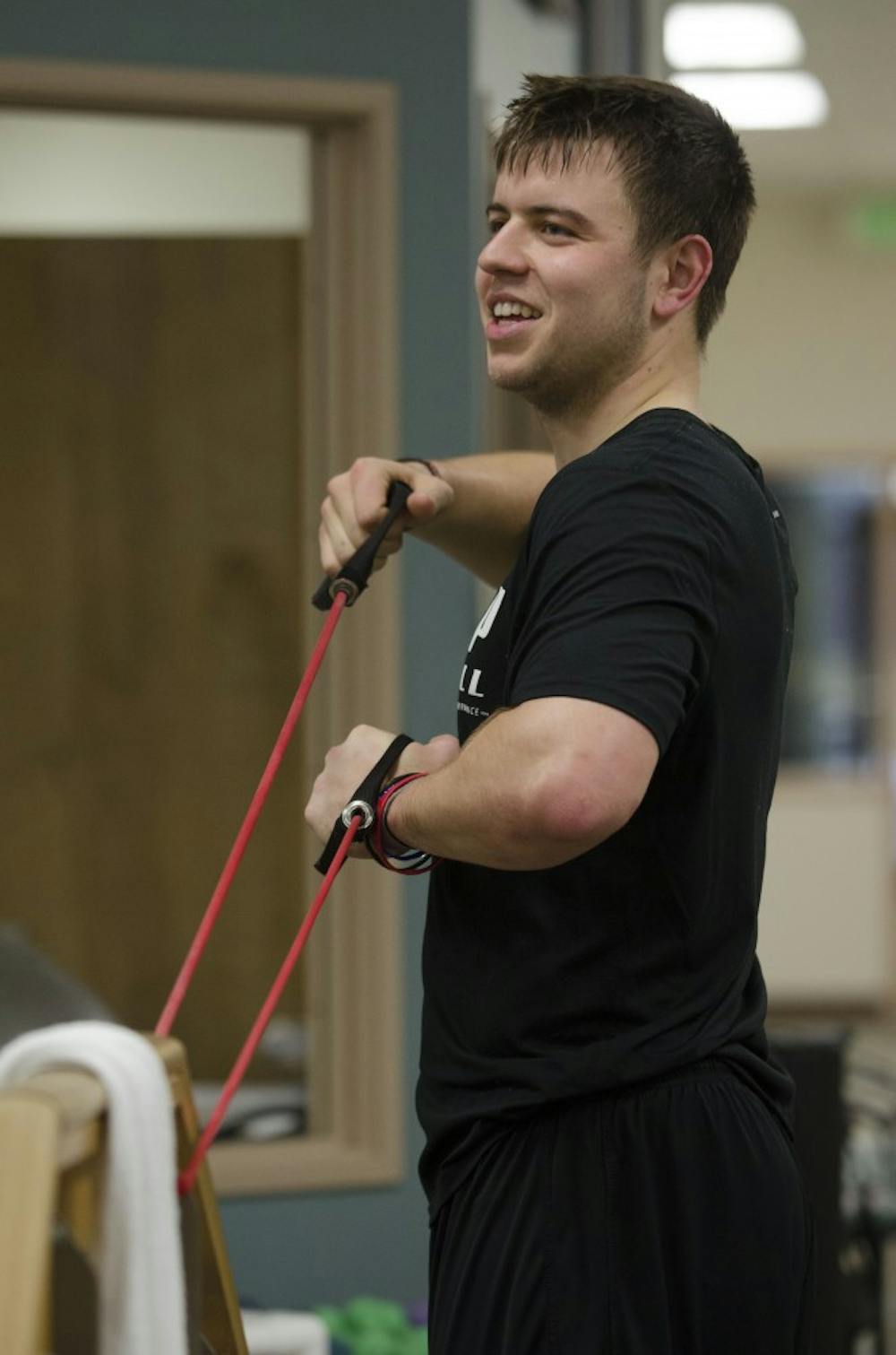 Keith Wenning works with a resistance band to stretch his arms on Feb. 1 at the St. Vincent Sports Performance Center in Indianapolis, IN. Wenning is training for the NFL Combine on Feb. 22-25. DN FILE PHOTO BREANNA DAUGHERTY