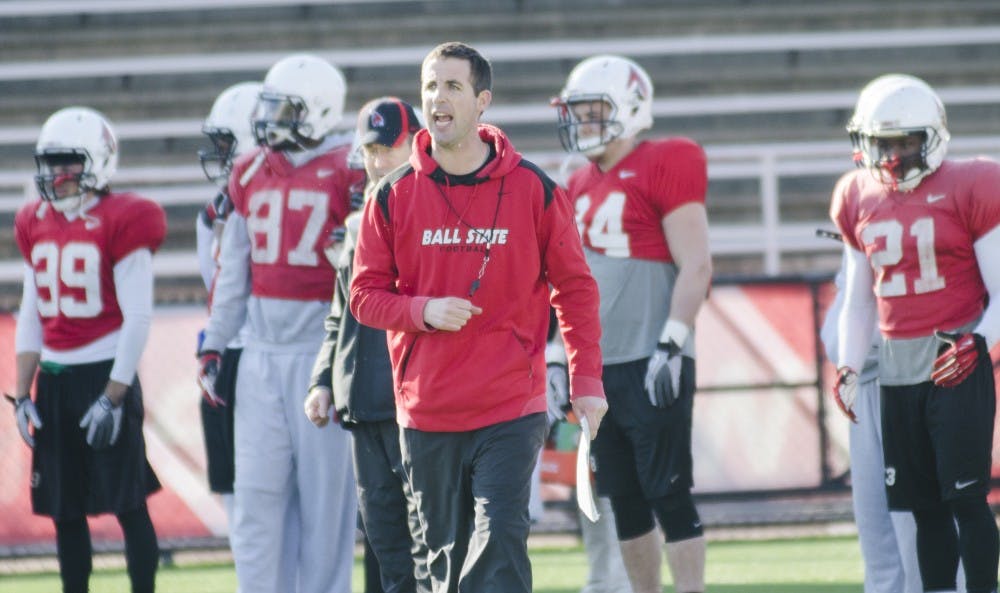 Joey Lynch coaches during a spring practice Friday. Lynch was hired as the offensive coordinator in December. DN PHOTO BREANA DAUGHERTY  