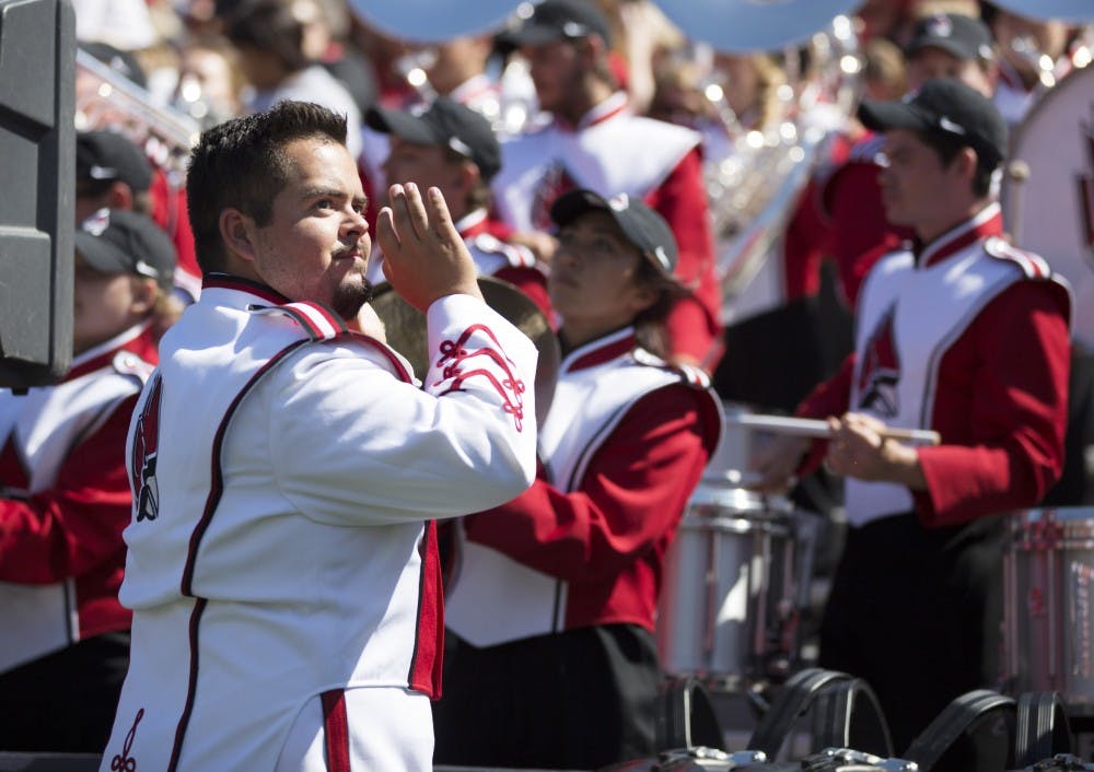 <p>Ball State band member looks at the video board during the game against the University of Illinois on Sept. 2, 2017. The Ball State band is playing with the "Pride of Mid-America" Marching Band on Sept. 9 at Schuemann Stadium for Band Day. &nbsp;Robby General, DN File</p>