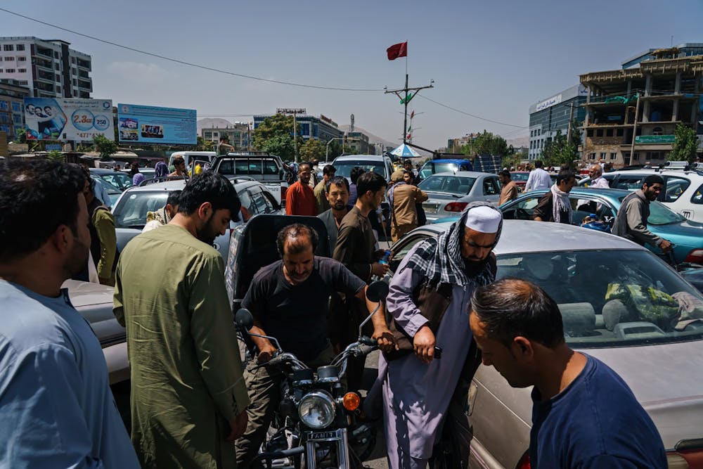 Pedestrians, motorists ended up in a traffic grid lock as the Afghans rush to safety with the uncertainty and rumor swirling that Taliban enter the city and take over, Kabul, Afghanistan, Sunday, Aug. 15, 2021. (Marcus Yam/Los Angeles Times/TNS)