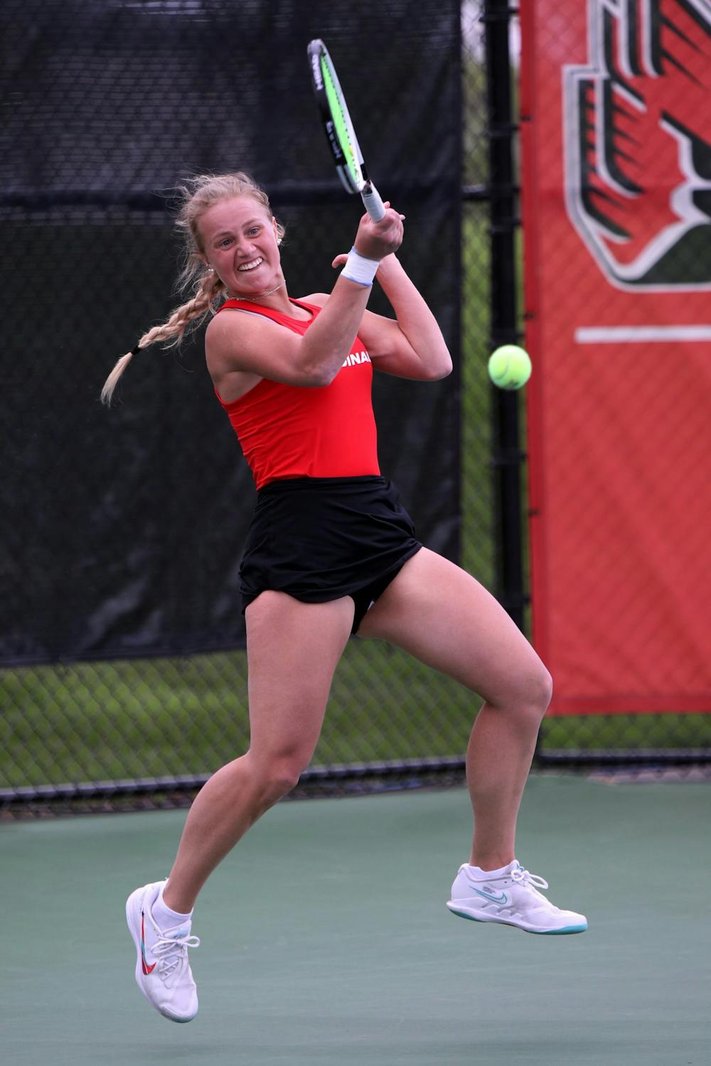 Senior Hannah Davies goes for the ball in a MAC Championship doubles match against Toledo May 1 at Cardinal Creek Tennis Couts. Amber Pietz, DN