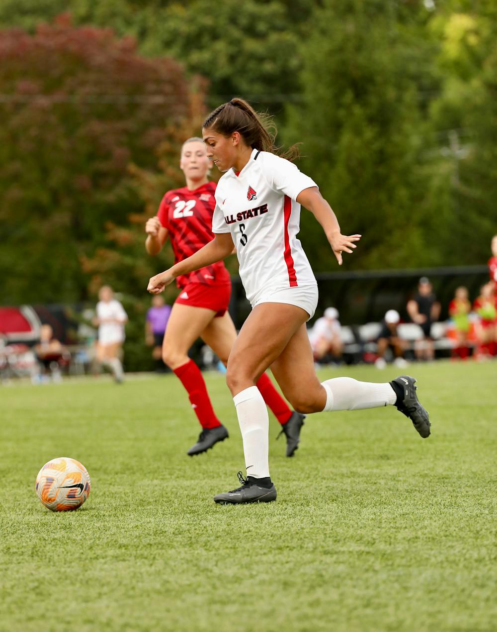 Sophmore forward Delaney Caldwell rears back for a pass upfield against Miami Sept. 21 at Briners Sports Complex. Caldwell was responsible for one of the Cardinals goals against the Redhawks. Andrew Berger, DN