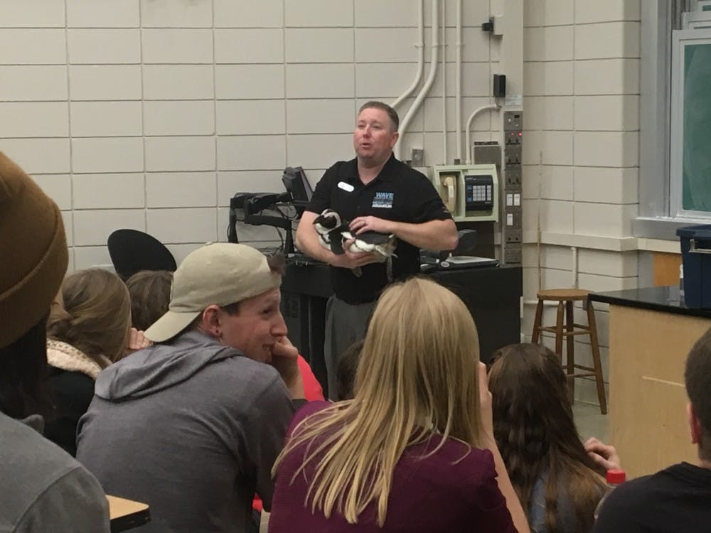 Dan Dunlap speaks to students about penguins and sharks on March 25. DN PHOTO VICTOR HAMILTON