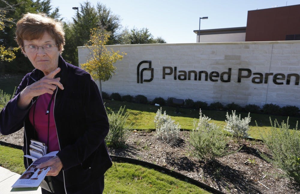 Marian Honquest, who is opposed to abortion, talks to a reporter in front of Planned Parenthood in Fort Worth, Texas, Friday, November 1, 2013. (David Kent/Fort Worth Star-Telegram/MCT)