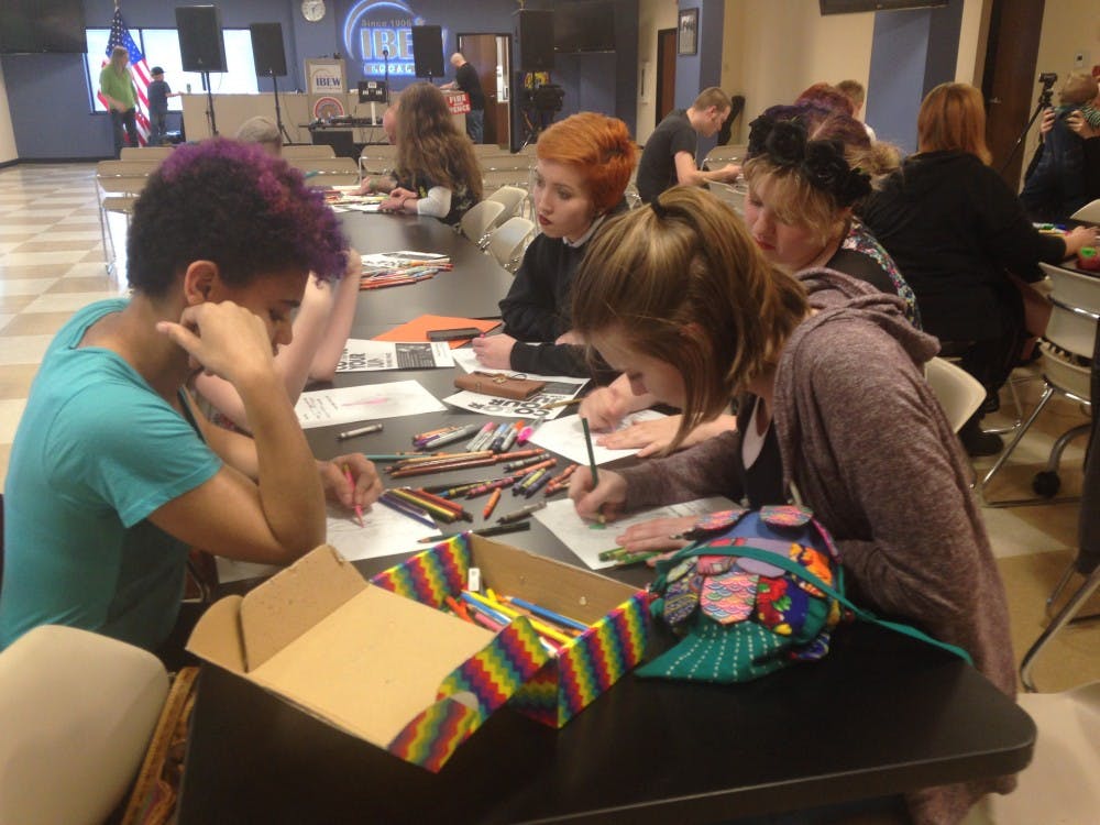 <p>Periods for Pence hosted a "Color Your Junk for Pence" event to protest the controversial abortion bill. DN PHOTO BAILEY SCHREWSBURY</p>