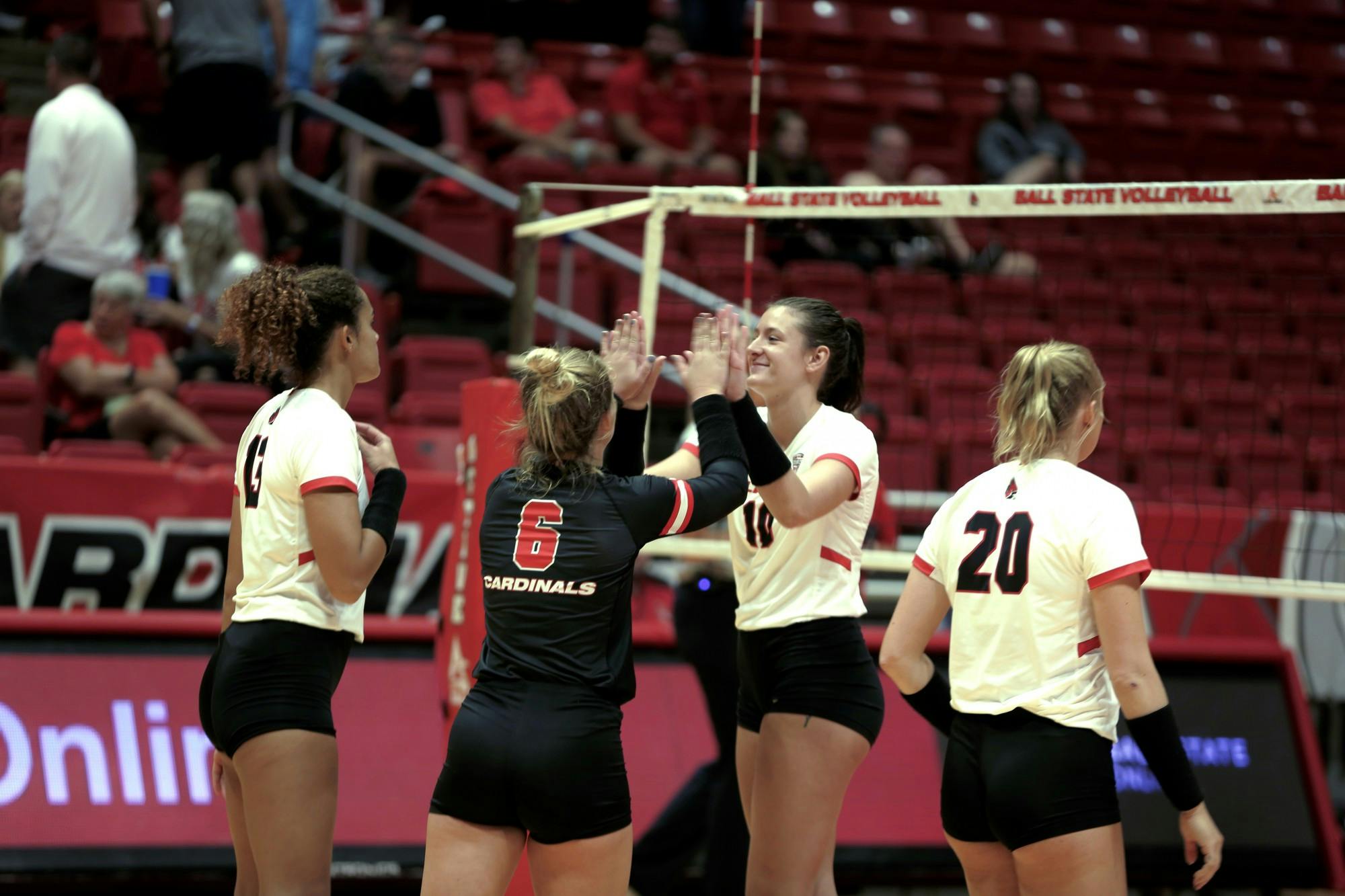 The Ball State Women's Volleyball team celebrates scoring a point over Arkansas State at Worthen Arena Sept. 9. Ball State swept Arkansas State. Caroline Stalvey, DN