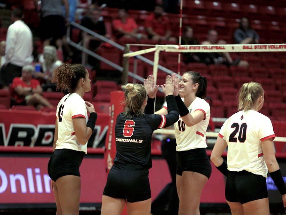 The Ball State Women's Volleyball team celebrates scoring a point over Arkansas State at Worthen Arena Sept. 9. Ball State swept Arkansas State. Caroline Stalvey, DN
