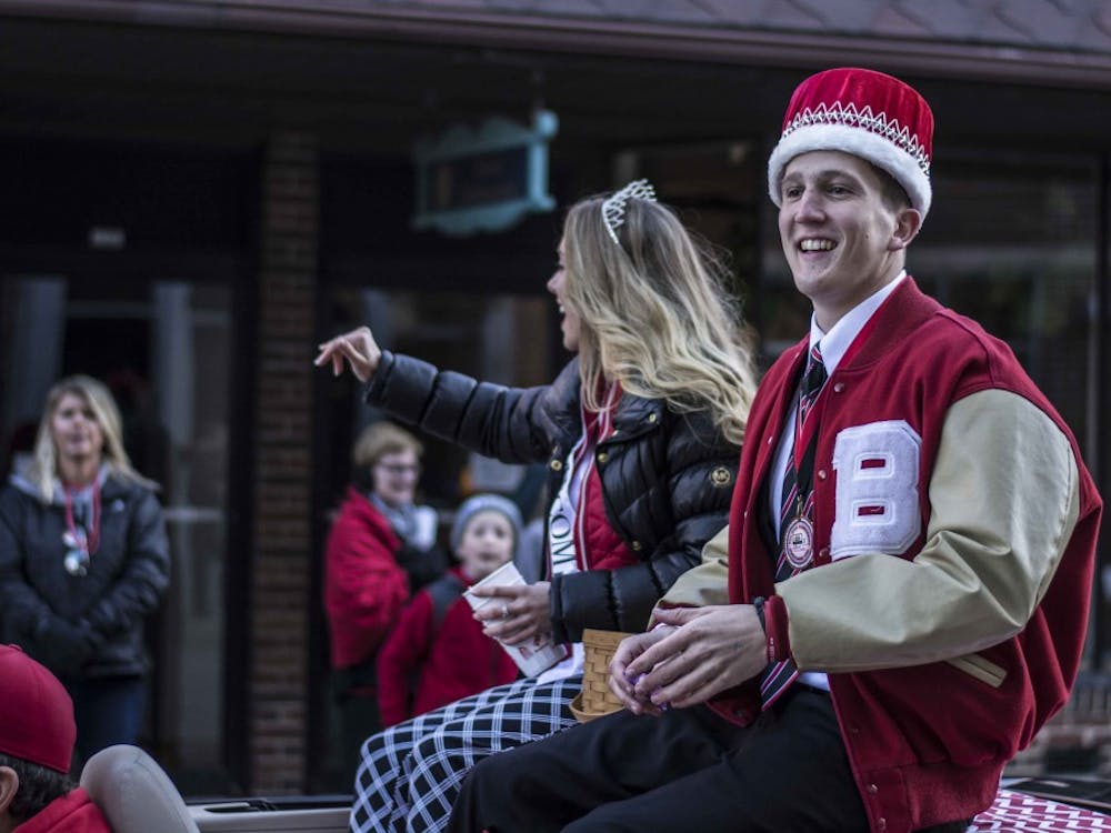 Homecoming King and Queen Mitch Prather and Samantha Johnson wave during the 2016 Homecoming Parade. Samantha Brammer, DN File