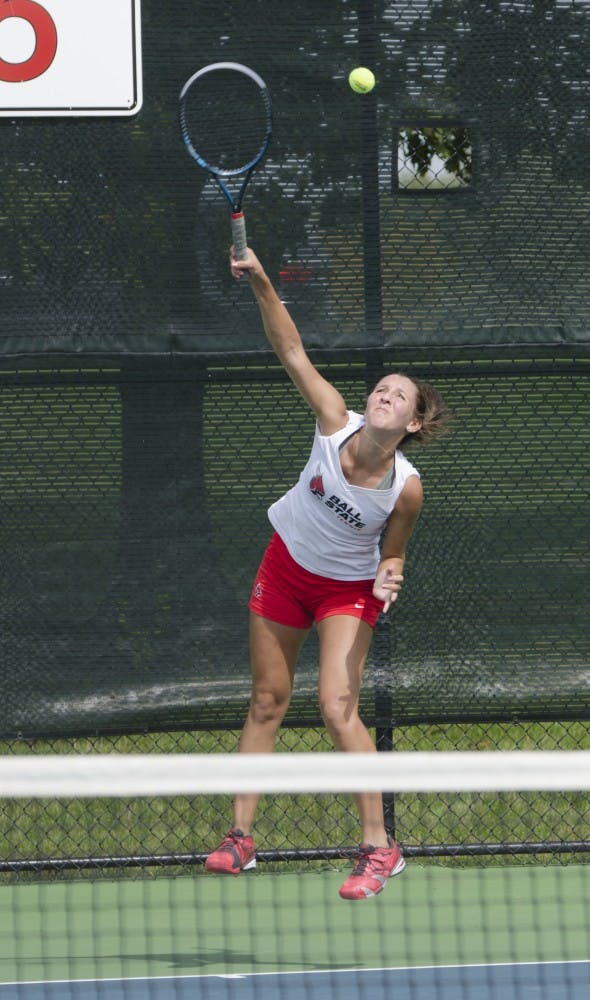 Sophomore Toni Ormond serves the ball during the doubles match against Butler for the Fall Dual on Sept. 20 at the Cardinal Creek Tennis Center. DN PHOTO BREANNA DAUGHERTY 