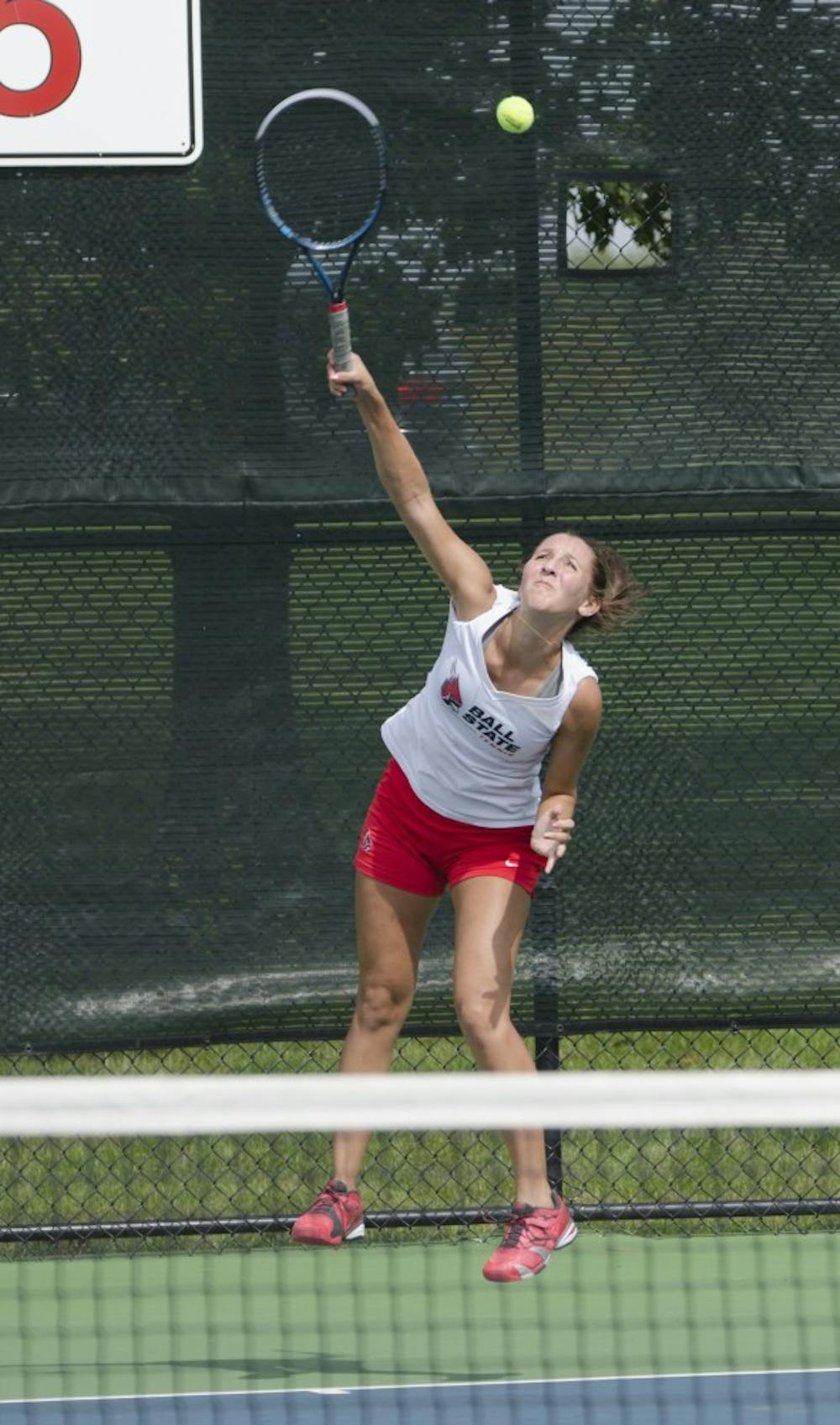 Sophomore Toni Ormond serves the ball during the doubles match against Butler for the Fall Dual on Sept. 20 at the Cardinal Creek Tennis Center. DN PHOTO BREANNA DAUGHERTY 