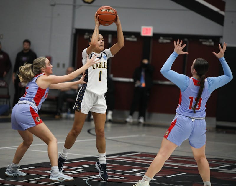 Delta junior Addison Barnes passes Feb. 15 in the regional championship game against Maconaquah at Wes-Del Middle/High School. This is the Eagles' first regional title in program history. Zach Carter, DN. 